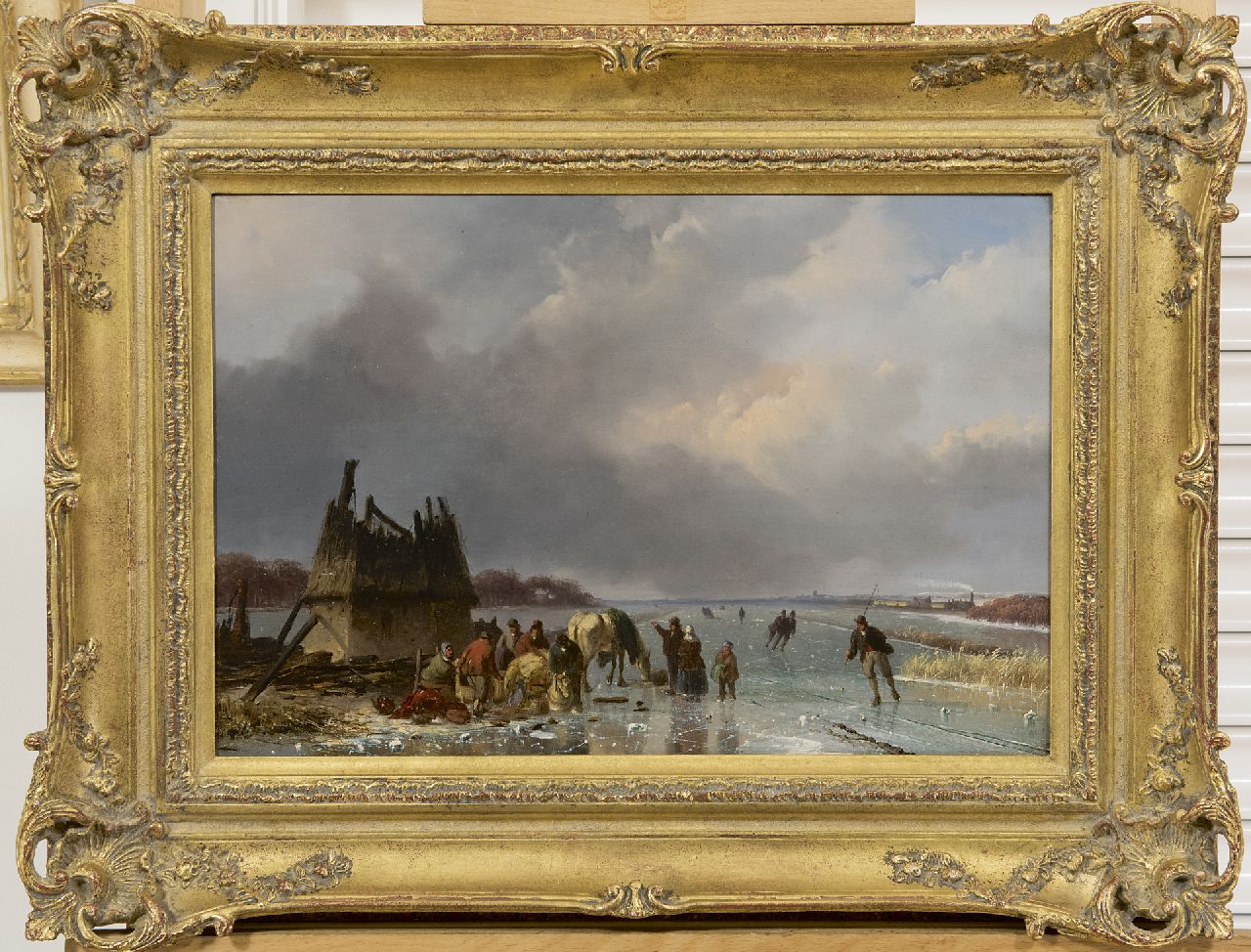 Roosenboom N.J.  | Nicolaas Johannes Roosenboom, IJsgezicht met schaatsers bij een molenruïne, rechts een stoomtrein, olieverf op paneel 29,4 x 43,7 cm, gesigneerd rechtsonder en te dateren ca. 1850-1855